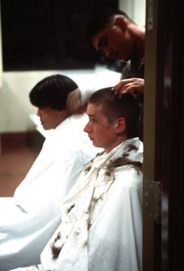 SGT. Francis Tauna, a staff member of the Hawaii National Guard Youth Challenge program, gives David Elliot a military type haircut. The Youth Challenge program offers troubled 16 to 18 year olds a second chance at getting a high school education to improve their prospects for the future.(Published in AIRMAN Magazine May 1996 ) Exact Date Shot Unknown