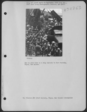 Men in chow line on a ship enroute to Port Moresby, Papua, New Guinea. (U.S. Air Force Number 3A32863)