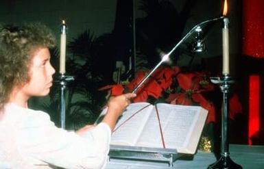 Sheril North assists with mass during the holiday season