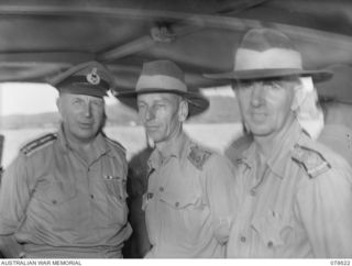 JACQUINOT BAY, NEW BRITAIN. 1945-01-12. N373078 CHAPLAIN GENERAL A.M. STEVENSON, MC, ED, AND FELLOW CHAPLAINS ABOARD THE LAUNCH OF THE GENERAL OFFICER COMMANDING 5TH DIVISION DURING A VISIT TO THE ..