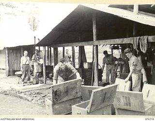 LAE, NEW GUINEA. 1944-09-28. HOT BOXES BEING PREPARED AT THE COOKHOUSE, 22ND WORKS COMPANY, ROYAL AUSTRALIAN ENGINEERS, FOR TROOPS WORKING ON THE WHARF. IDENTIFIED PERSONNEL ARE:- V503206 PRIVATE ..