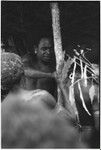 Pig festival, wig ritual, Tsembaga: applying sap to harden wig