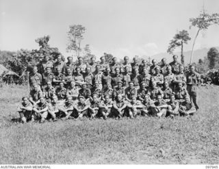 Torokina, Bougainville. 1945-10-12. Group portrait of the members of A Troop, 4th Battery, 2nd Field Regiment. Left to right, back row: V33411 Gunner (Gnr) S. J. Sainty of Brunswick, Vic; VX878505 ..