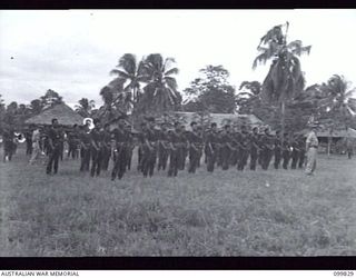 LAE, NEW GUINEA, 1946-02-14. MEMBERS OF THE ROYAL PAPUAN CONSTABULARY ON PARADE, AWAITING THE ARRIVAL OF MAJOR GENERAL B.M. MORRIS, GENERAL OFFICER COMMANDING, AUSTRALIAN NEW GUINEA ADMINISTRATIVE ..