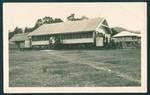 View of Bulolo Gold Dredging mine's general mess with accommodation buildings in background, Bulolo, New Guinea, c1929 to 1932