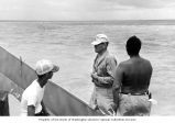 Lauren R. Donaldson (center) and colleagues approaching Rigili Island, summer 1964