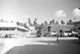 Guam, truck driving through village