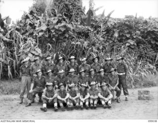 Group portrait of the personnel of 12 Air Maintenance Platoon, 30 Advanced Supply Depot. Left to right, back row: Q127447 Private (Pte) R C Alcock; Q268365 Pte B Drayton; NX180380 Pte J C Gillan; ..