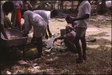 Malaria Control Service national staff prepare an earth oven for a party (7) : Papua New Guinea, 1976-1978 / Terence and Margaret Spencer