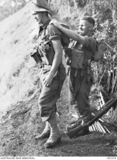 SHAGGY RIDGE, NEW GUINEA. 1943-12-27. TROOPS ADJUSTING THEIR PACKS PRIOR TO THE 2/16TH AUSTRALIAN INFANTRY BATTALION, 21ST AUSTRALIAN INFANTRY BRIGADE ATTACK ON THE JAPANESE HELD "PIMPLE". ..