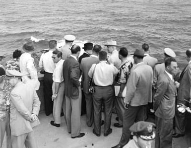 President Truman and others view blow hole during tour of Hawaii