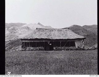 BENA BENA, NEW GUINEA. C.1944. HOSPITAL (`HAUS SICK') BUILT OF LOCAL MATERIALS ON THE PLATEAU AT BENA BENA, IN THE HIGHLANDS BETWEEN LAE AND MADANG. THE HOSPITAL WAS BUILT UNDER THE SUPERVISION OF ..
