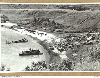 WALINGAI BEACH, NEW GUINEA. 1944-01-02. STORES BEING UNLOADED AT THE DEPOT OF THE 15TH PLATOON, C COMPANY, 2/48TH INFANTRY BATTALION