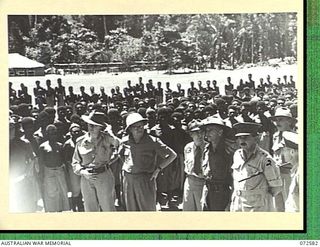 MALAHANG, NEW GUINEA. 1944-04-23. THE HONOURABLE E.J. WARD, MINISTER FOR EXTERNAL TERRITORIES IN THE AUSTRALIAN GOVERNMENT (1), WITH MEMBERS OF THE OFFICIAL PARTY DURING AN INSPECTION OF NATIVES AT ..