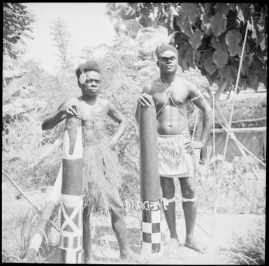 Two men with wooden trumpets, New Guinea, ca. 1936 / Sarah Chinnery