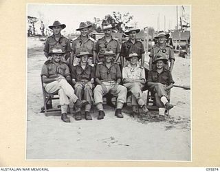 WIRUI BEACH, WEWAK AREA, NEW GUINEA. 1945-08-31. OFFICERS OF 2/1 FIELD AMBULANCE. AMONG THEM STANDS THEIR COMMANDING OFFICER, LIEUTENANT COLONEL K.A. MCGARRITY (3) AND LIEUTENANT J.J. SAVAGE, ..