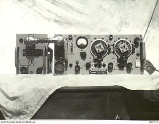 MADANG, NEW GUINEA. 1944-10-12. THE NO. 19 (?RADIO) SET M3 FROM A CHURCHILL VII TANK DISPLAYING THE FRONT PANEL AND THE POWER UNIT. THE TANK IS ENGAGED IN TESTS AT HQ 4 ARMOURED BRIGADE