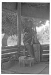 Man preparing kava by pounding.