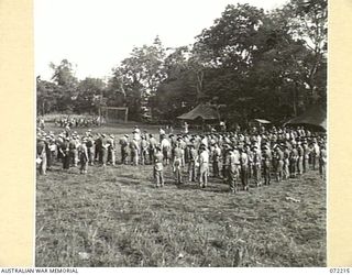 GUSIKA, NEW GUINEA. 1944-04-09. MEMBERS OF THE 2/4TH LIGHT ANTI-AIRCRAFT REGIMENT AT A MEMORIAL SERVICE HELD IN HONOUR OF MEMBERS WHO WERE KILLED IN ACTION IN THE FINSCHHAFEN - SCARLET BEACH AREA. ..