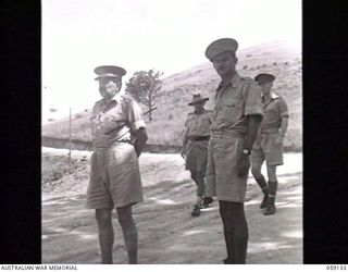 KILA, NEW GUINEA. 1943-10-24. PP1 MAJOR GENERAL B. M. MORRIS DSO, GENERAL OFFICER COMMANDING, AUSTRALIAN AND NEW GUINEA ADMINISTRATIVE UNIT (ANGAU) ADDRESSING THE NATIVES AT THE LABOUR CAMP