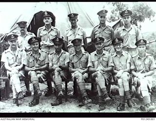 PORT MORESBY, NEW GUINEA, 1943-03-27. GROUP PORTRAIT OF OFFICERS OF RAAF NO. 2 MOBILE WORKS SQUADRON LATER NO. 2 AIRFIELD CONSTRUCTION SQUADRON. LEFT TO RIGHT: BACK ROW: FLIGHT LIEUTENANT (FLT LT) ..