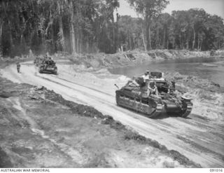 BOUGAINVILLE. 1945-04-16. MATILDA TANKS OF B SQUADRON, 2/4 ARMOURED REGIMENT ATTACHED 3 DIVISION, MOVING ALONG THE BUIN ROAD SOUTH OF THE PURIATA RIVER TO SUPPORT THE INFANTRY ADVANCE TOWARDS THE ..