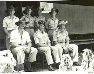 SOME MEMBERS OF THE STAFF OF RAAF METEOROLOGICAL SECTION, MILNE BAY, NEW GUINEA, 1945-08. CENTRE - FLYING OFFICER J.R. JOYCE O.I.C., EXTREME LEFT - FLYING OFFICER W. JORDAN