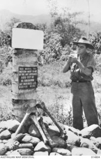 1943-05-07. NEW GUINEA. MILNE BAY. THIS MONUMENT HAS BEEN ERECTED IN MEMORY OF OFFICERS AND MEN WHO DIED DEFENDING TURNBILL FIELD. THE SIGN ON THE MONUMENT READS. "THIS MARKS THE WESTERN-MOST POINT ..