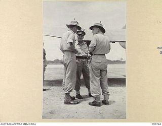 RABAUL, NEW BRITAIN. 1945-10-05. MAJOR GENERAL C.S. STEELE, ENGINEER-IN-CHIEF, LAND HEADQUARTERS (2) WITH LIEUTENANT COLONEL H.B. MURN (1) AFTER LANDING ON VUNAKANAU AIRSTRIP. MAJOR GENERAL STEELE ..