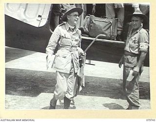 TOROKINA, BOUGAINVILLE, SOLOMON ISLANDS. 1945-03-14. THE ANGLICAN BISHOP OF NEW GUINEA, VX91744 CHAPLAIN P.N.W. STRONG ARRIVING FROM LAE