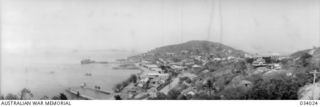 Port Moresby, Papua. 1942-07-15. A panoramic view of Port Moresby township, wharves and a section of the harbour