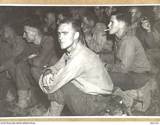 DUMPU, NEW GUINEA. 1943-12-10. TROOPS AT A PICTURE SHOW PUT ON BY THE 85TH AUSTRALIAN MOBILE CINEMA UNIT, AUSTRALIAN ARMY AMENITIES, 7TH AUSTRALIAN DIVISION