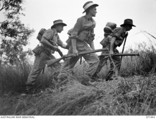 PORT MORESBY, NEW GUINEA, 1944-03-24. Q271046 PRIVATE C.E. BESS (1); QX54630 PRIVATE J.W. MILES (2) AND Q144463 PRIVATE J. LENTELL (3), POSING FOR A PHOTOGRAPH TAKEN FOR V93667 CAPTAIN G.H. ALLEN, ..