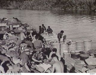 TERAPO, NEW GUINEA. 1943-06-30. TROOPS AND STORES BEING MOVED BY THE 1ST AUSTRALIAN WATER TRANSPORT GROUP (SMALL CRAFT). THE NATIVE LABOURERS WITH STORES ON THEIR LAKETOI CRAFT ARE BEING TOWED BY ..