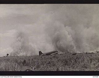 NADZAB AREA, NEW GUINEA. 1943-09-20. DENSE CLOUDS OF SMOKE RISING FROM BURNING KUNAI GRASS, AFTER NO. 2 NADZAB AIRSTRIP HAD BEEN BOMBED BY JAPANESE RAIDERS