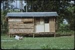 House occupied by the Hutchins, with corrugated metal roof