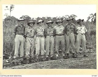 LAE, NEW GUINEA. 1944-03-29. OFFICERS AT THE 103RD FIELD AMMUNITION DEPOT. LEFT TO RIGHT: SX23116 LIEUTENANT (LT) A. B. MAY, 19TH ORDNANCE AMMUNITION COMPANY; V256742 LT A. ALLEN, 10TH ADVANCED ..