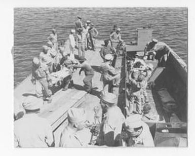 [Wounded Soldiers Being Moved Off a Transport Boat]