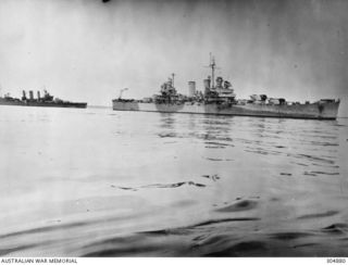 ADMIRALTY ISLANDS. C.1944. STARBOARD SIDE VIEW OF TWO CRUISERS OF TASK FORCE 74, HMAS AUSTRALIA (LEFT) AND USS NASHVILLE. NOTE THE DIFFERENCE IN CAMOUFLAGE SCHEMES, AUSTRALIA'S AN ALL OVER DARK ..