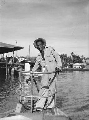 [Man possibly standing on the prow of a boat]