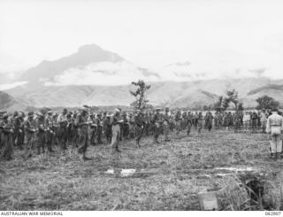 DUMPU, NEW GUINEA. 1944-01-16. THE 58/59TH INFANTRY BATTALION CEREMONIAL CHURCH PARADE IN PROGRESS AT THE UNIT HEADQUARTERS. ATTENDING THE PARADE WERE VX9 MAJOR GENERAL G.A. VASEY CB., CBE., DSO., ..