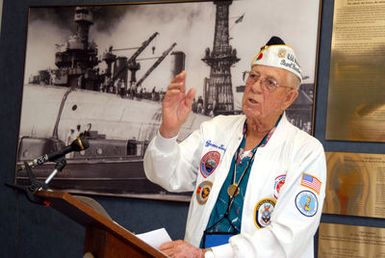U.S. Navy USS OKLAHOMA survivor James Bounds tells the story of how he and his shipmates were rescued by Naval Station Pearl Harbor Shipyard workers following the events of Dec. 7, 1941, during the Pearl Harbor Naval Shipyard's USS OKLAHOMA Lobby Display Dedication ceremony Pearl Harbor, Hawaii. The renovation and dedication honors the historic tie between the Pearl Harbor Shipyard workers who aided in the rescue of 32 Sailors from the capsized ship in the days following on Dec. 7, 1941. (U.S. Navy PHOTO by Mass Communication SPECIALIST 1ST Class James E. Foehl) (Released)