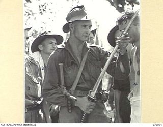 SIO, NEW GUINEA. 1944-01-24. 6960611 C.M. STEWART (1) OF THE UNITED STATES ARMY, VOLUNTEERED FOR SERVICE IN 1939. SEEKING COMBAT HE TRANSFERRED FROM AN AMERICAN PROVISION TRUCK COMPANY AT TAYLORS ..