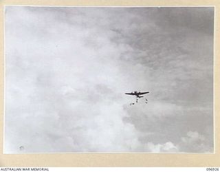 KAHILI, BOUGAINVILLE. 1945-09-10. SUPPLIES BEING DROPPED FROM KAHILI AIRSTRIP FOR THE BUIN LIAISON PARTY FROM HEADQUARTERS 2 CORPS. THE BUIN LIAISON PARTY IS ORGANISING SURRENDER DETAILS IN THE ..