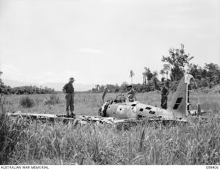 KARAVAT, RABAUL, NEW BRITAIN. 1945-10-30. WRECKED JAPANESE AIRCRAFT ON THE KARAVAT AIRSTRIP