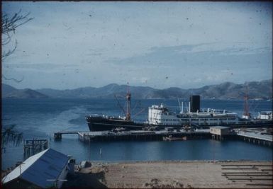 The wharf and Changsha at Port Moresby harbour. A warehouse stands on the left : Port Moresby, Papua New Guinea, 1953 / Terence and Margaret Spencer