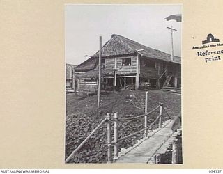 SANGARA, NEW GUINEA, 1945-07-05. THE SIGNAL MAINTENANCE HUT ADJOINING SANGARA RUBBER PLANTATION. THIS SIGNAL SECTION MAINTAINS THE LINE FROM "CARRIER" DOBODURA TO LAE IN THE SANGARA AREA