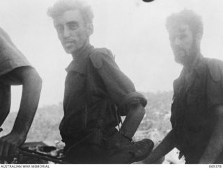 PORT MORESBY, NEW GUINEA. 1942-04-12. HMAS "LAURABADA" WITH SERVICE PERSONNEL AND CIVILIANS WHO HAD TAKEN TO THE JUNGLE OF NEW BRITAIN AFTER THE WITHDRAWAL OF THE HOPELESSLY OUTNUMBERED RABAUL ..