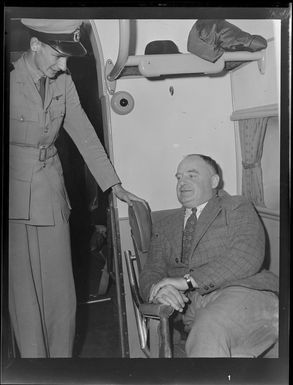 Mr E Roberts, General Manager, Tasman Empire Airways Limited, on flight to Fiji, includes interior view of aircraft and captain in uniform.