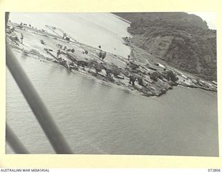 SALAMAUA, NEW GUINEA. 1944-04-30. THE TOWN VIEWED FROM A STINSON MONOPLANE AIRCRAFT FLOWN BY Q14251 CAPTAIN N. R. WILDE, AUSTRALIAN NEW GUINEA ADMINISTRATIVE UNIT, LIAISON OFFICER ATTACHED TO 54TH ..